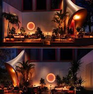 VOLAR CLUB 户外前场，棕榈树与圆形灯光装置